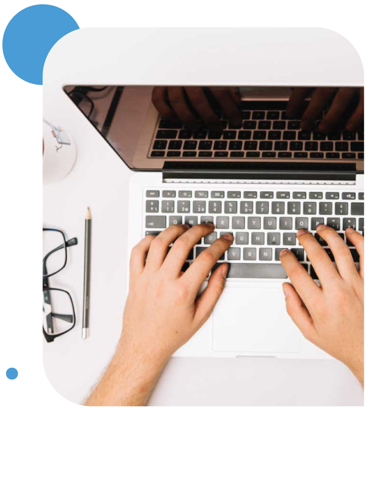 Person typing on a laptop, representing Wikipedia page creation services.
